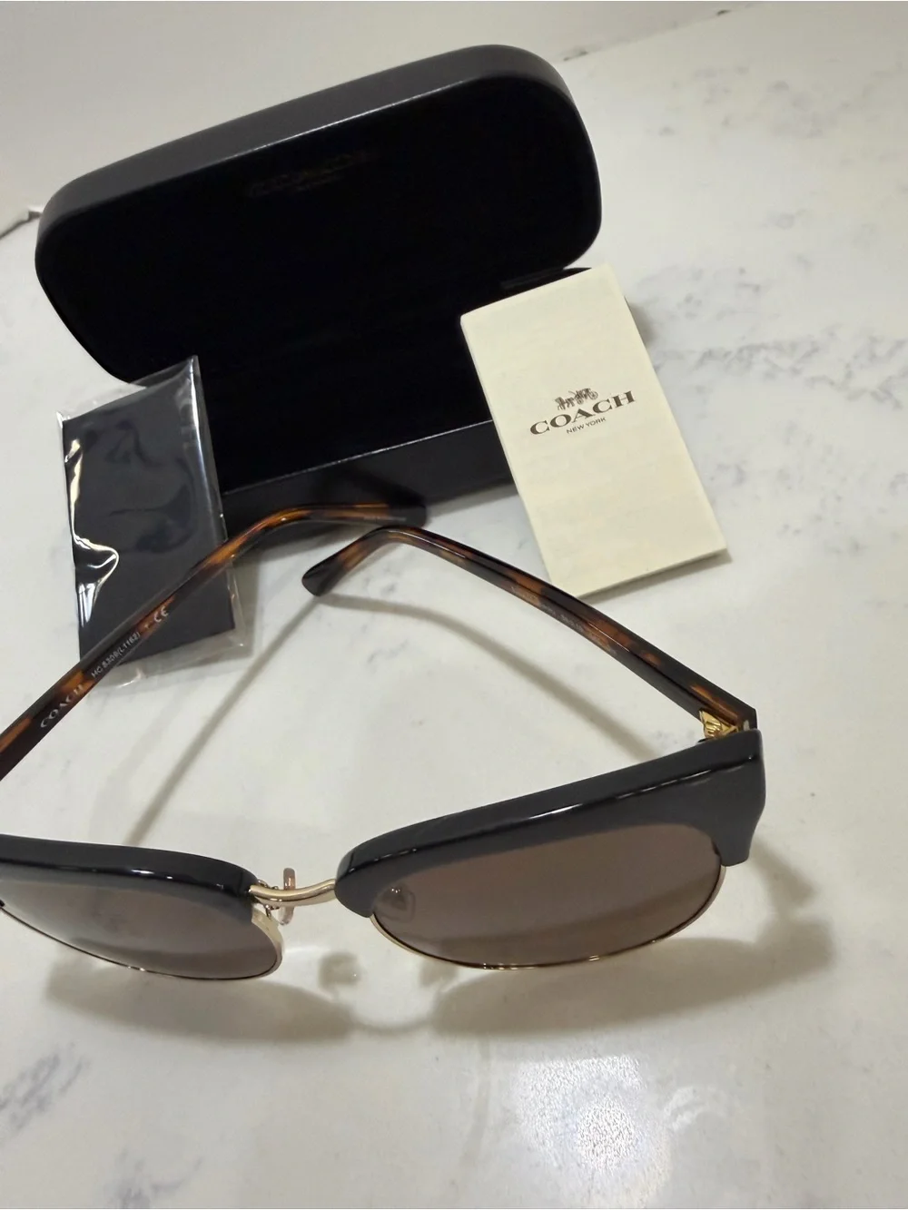 Coach Black Frame Sunglasses with Gold Trim and Brown Lenses